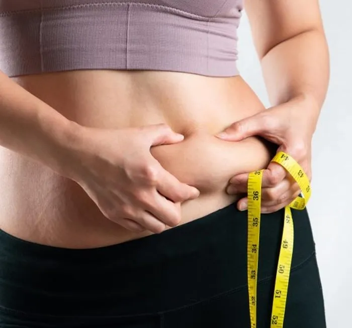 Close-up of stubborn belly fat targeted by Javatide's metabolism support