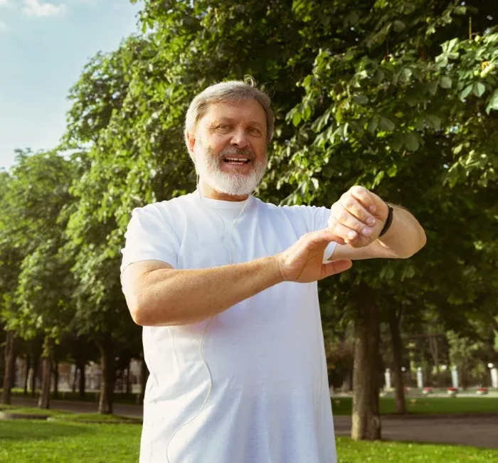Man stretching outdoors after regaining energy and motivation to exercise